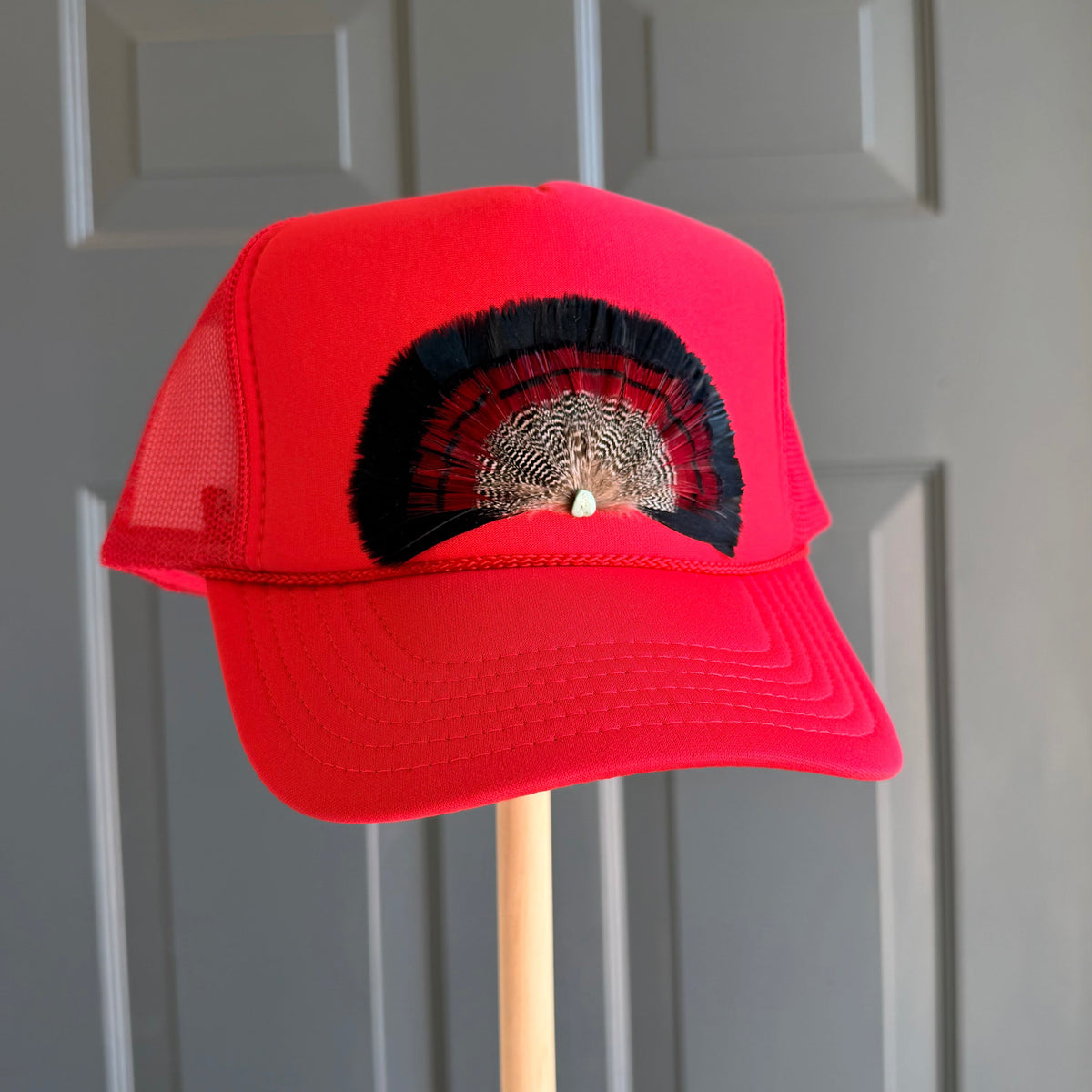 Red Bullseye Feather Trucker Hat
