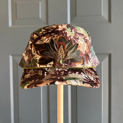 Abstract Camo Artemis Feathers Trucker Hat