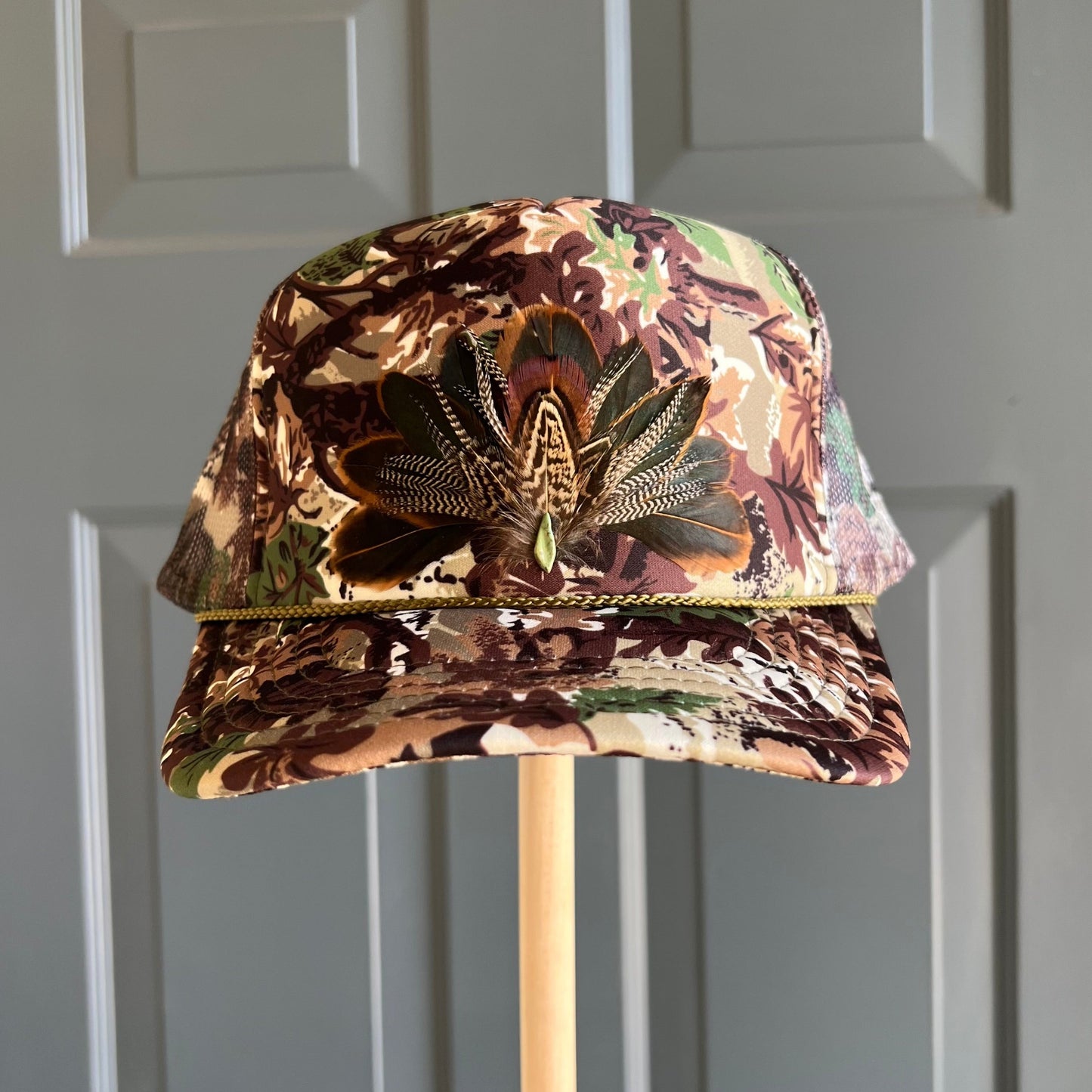 Abstract Camo Artemis Feathers Trucker Hat