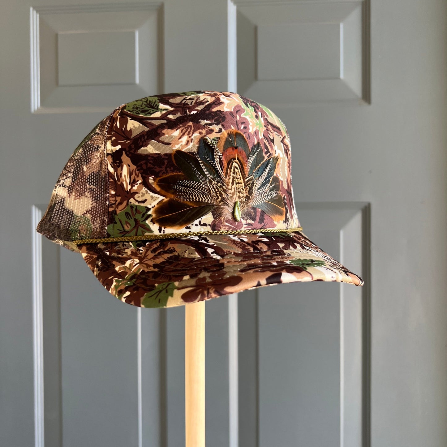 Abstract Camo Artemis Feathers Trucker Hat