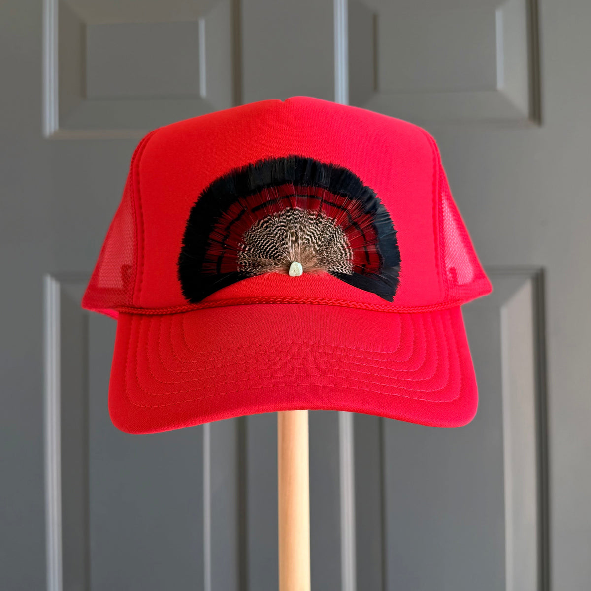 Red Bullseye Feather Trucker Hat