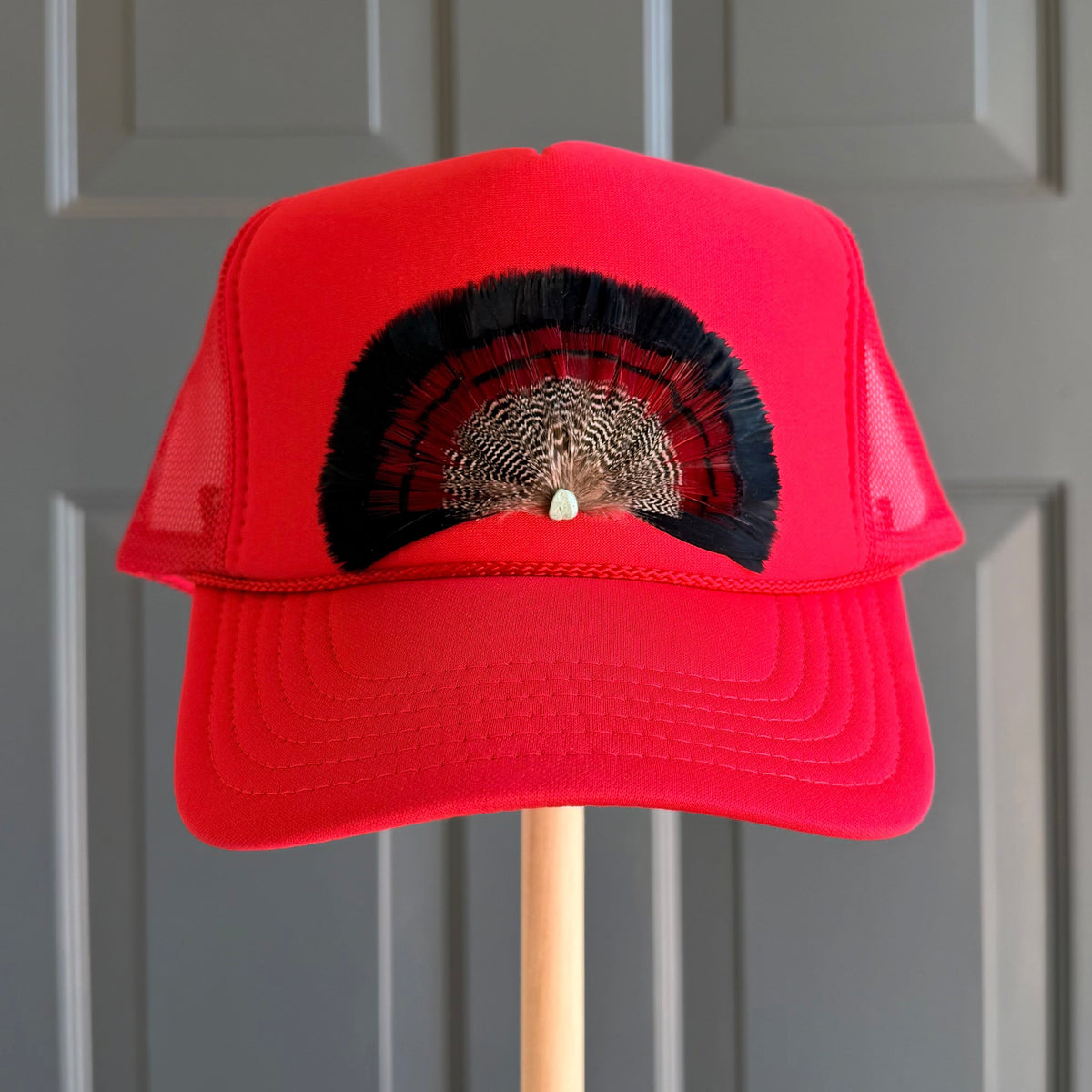 Red Bullseye Feather Trucker Hat