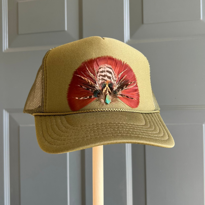 Green cap with a colorful design on a gray background