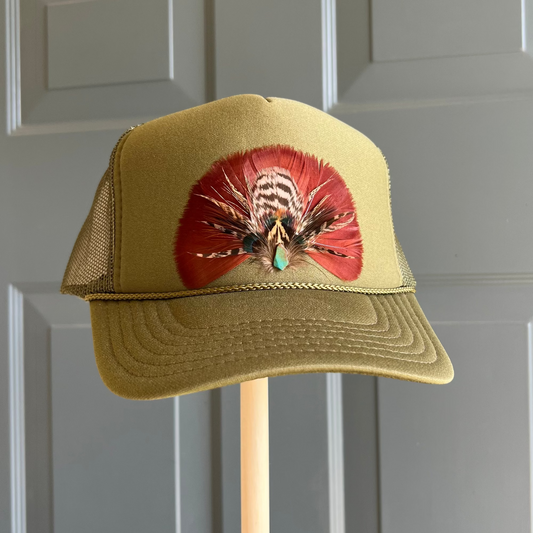 Green cap with a colorful design on a gray background